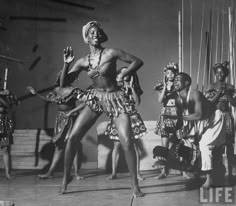 an old black and white photo of dancers