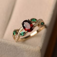 Lab Created Ruby Wedding Ring, July Birthstone Ring, Stacking Ring, 925 Sterling Silver Ruby Emerald Ring, Art Deco Ring, Gift For Her *Primary Stone: Lab Grown Ruby *Stone Color: Red *Stone Shape: Oval *Stone Size: 6x4mm *Secondary Stone Type: Emerald *Stone Size: 2x4mm *Stone Color: Green *Stone Shape: Marquise Other Stone : CZ Diamond Jewelry Type: Ring Metal: Silver Method: Cast Personalization: Possible Style: Wedding Ring Set Ring Size: We make rings from US 3 to US 16. This elegant ring i Garnet Wedding Rings, Ruby Wedding Rings, Garnet Wedding, Smaragd Ring, July Birthstone Ring, Leaf Engagement Ring, Ruby Wedding, Ruby Engagement Ring, Ring Stacking