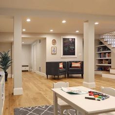 a living room filled with furniture and a white table