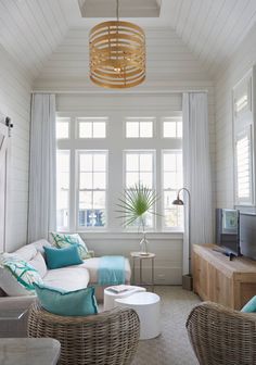 a living room filled with furniture and a flat screen tv