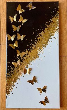 a painting with gold butterflies on it