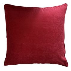 a red pillow on a white background