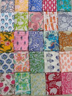 a patchwork quilt with many different colors and designs