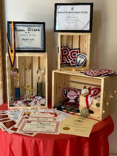 two wooden boxes with awards on top of a table