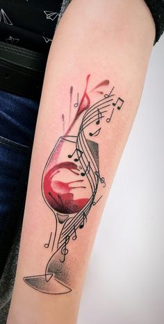 a wine glass with musical notes on it