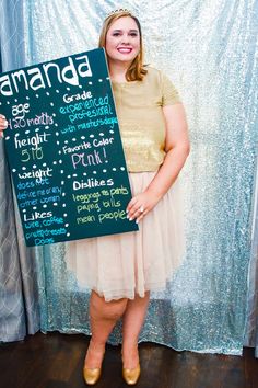 a woman is holding up a sign that says amanda and the words are written on it