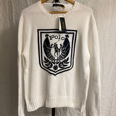 Polo Ralph Lauren White Crest Logo Embroidered Cotton Knit Sweater - Men's Size Large - Brand New With Tags. Classic White Sweater With Embroidered Logo, Classic Embroidered Logo Sweater For Winter, Classic Winter Sweater With Embroidered Logo, White Cotton Polo Sweater With Ribbed Cuffs, Classic Winter Top With Embroidered Logo, Designer White Sweater, Designer White Long Sleeve Sweater, Designer White Winter Sweater, White Embroidered Logo Sweater For Fall