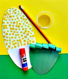 a pair of scissors and some markers on a table