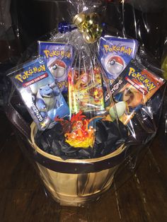 a basket filled with pokemon cards and snacks