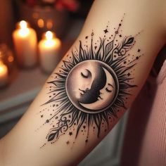 a woman's arm with a sun and moon tattoo on it