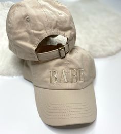 "EMBROIDERED BEIGE BABE BASEBALL CAP The perfect way to show off being a babe! These super cute beige, dad style baseball caps are 100% embroidered with the word \"BABE\" in beige thread. Caps are fully adjustable. RETURNS/EXCHANGES are not accepted. Should there be any issues with your order, please reach out so we can work together to find a resolution. Thank you for visiting Golden Touch Embroidery! Should you have any questions/inquiries, feel free to send me a message." Embroidered Cream Cap, Cream Embroidered Cap, Adjustable Embroidered Party Hat, Bachelorette Party Hats, Bridal Party Hats, Bachelorette Party Hat, Dad Style, Dad Fashion, Baseball Hat