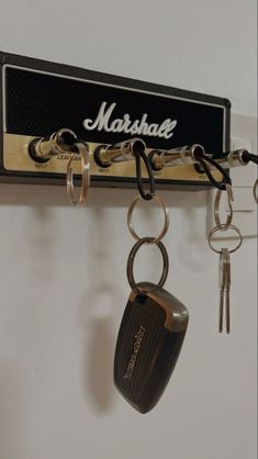 a key holder with keys hanging from it