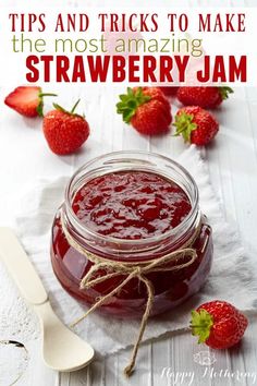 strawberry jam in a glass jar with strawberries around it and the words tips and tricks to make the most amazing strawberry jam