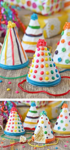 small white and multicolored plastic hats with red ribbon on the top, sitting on a table