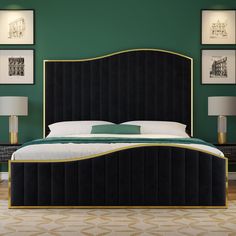 a bedroom with green walls and gold trimmings on the bed, along with two lamps