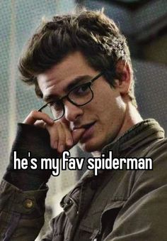 a man in glasses talking on a cell phone with the caption he's my fav spiderman