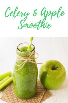 a green smoothie in a mason jar next to an apple