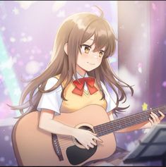 a girl with long hair is playing the guitar