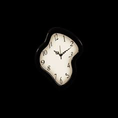 a black and white clock in the dark with no numbers on it's face