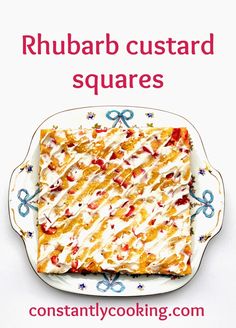 a square cake on a plate with the words rhubarb custard squares