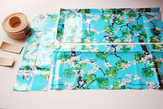 the fabric is laid out on the table to be used for making decorative wall hangings