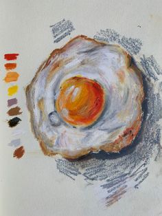 a drawing of an egg on top of a piece of wood with colored pencils