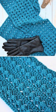 a crocheted blue tie with black gloves on it