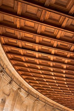 an ornate wooden ceiling in a building