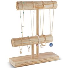 a wooden jewelry stand with several necklaces and rings hanging from it's sides