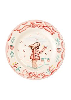 a pink and white plate with a girl on it