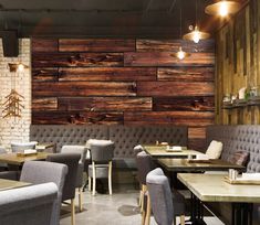 the interior of a restaurant with wood paneling on the walls and tables in front of them