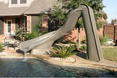 a water slide in front of a house