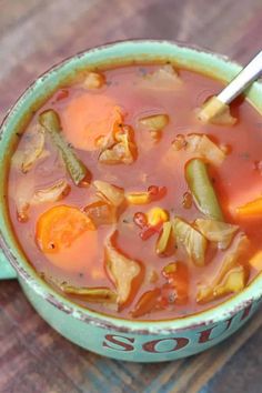 a close up of a bowl of soup on a table