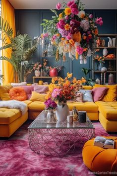 a living room filled with yellow couches and lots of colorful flowers on top of them