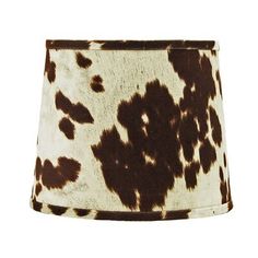 a brown and white cow print lamp shade on a white background with the bottom off