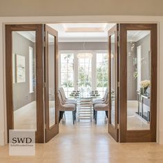 an open door leading to a formal dining room