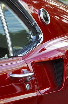 a red car parked on the side of the road