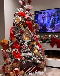 a christmas tree decorated with gingerbreads, candy canes and other holiday decorations