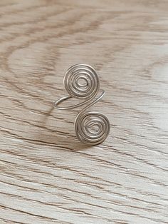 A simple spiral made into a statement ring Elegant Spiral Metal Rings, Handmade Sterling Silver Spiral Rings, Handmade Silver Spiral Ring, Vintage Silver Spiral Ring, Nickel-free Silver Spiral Rings, Funky Jewellery, Spiral Ring, Xmas Presents, Funky Jewelry