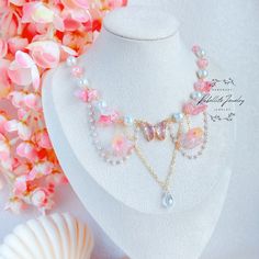 Step into a world of enchantment with our handmade Blush Pink Blossom Choker Necklace, a magical accessory that captures the essence of fairy and princesscore aesthetics. Adorned with a stunning crystal butterfly centerpiece, surrounded by delicate glass beads and flowers, this necklace is designed to add a touch of whimsical charm to your look. 🌸 Key Features: Pink Crystal Butterfly: The centerpiece of this necklace is a captivating pink crystal butterfly, symbolizing transformation and beauty Princesscore Fashion, Butterfly Centerpiece, Necklace Fairycore, Butterfly Centerpieces, Prom Necklace, Necklace Fairy, Prom Necklaces, Magical Accessories, Fairy Necklace