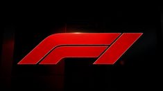 the logo for formula racing is shown in this dark room with light shining on it