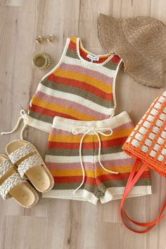 Being the sweetest babe is a piece of cake when you're wearing the Effortlessly Nice Multi Striped Crochet Side-Tie Sleeveless Top! Soft, lightweight crochet knit boasts a cute striped design (in hues of cream, pink, yellow, terracotta, and olive green), as it shapes this lil' top that has a crew neckline and a sleeveless silhouette. Slightly cropped, boxy bodice features lace-up details at the sides that secure with cute bows at the hems. Lil Top, Girl Vacation, Summer Closet, Aesthetic Crochet, A Piece Of Cake, Knitting Videos, Piece Of Cake, London Life, Fashion House