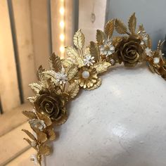 The Penelope crown features gold leaves set to stand up on a headband with hand painted gold roses, mother of pearl flowers, enamelled flowers  and pearls. The crown is lightweight and easy to wear. Bridesmaids combs are available in various sizes to match Please allow 4-6 weeks for delivery, if you would like a bespoke version of this crown, please enquire This crown can be made in silver and rose gold Flowers And Pearls, Headpiece Diy, Pearl Flowers, Rose Crown, A Night At The Opera, Gold Roses, Golden Crown, Fantasy Wedding, Gold Leaves