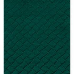 a green quilted fabric with diamond design on it's edges and the back side