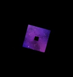 a square shaped object in the dark with stars on it