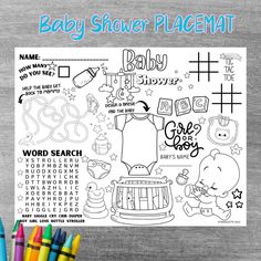 the baby shower placemat is shown with crayons and markers