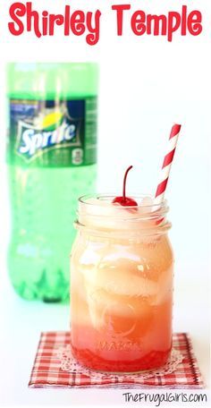 a drink in a mason jar with a red and white striped straw