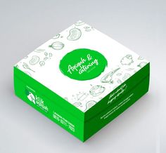 a green and white box with drawings on it