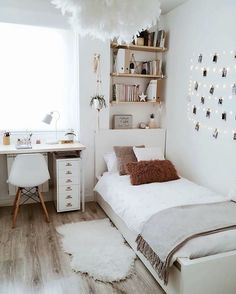 a bedroom with white walls and wooden flooring is featured in the video, which shows an image of a bed that has been made into a headboard