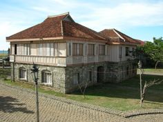 an old building with a red tiled roof